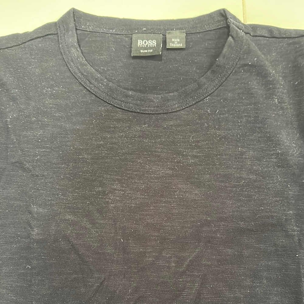 BOSS Men's Black T-Shirt. The shirt was left in sun and the fold is discolored.